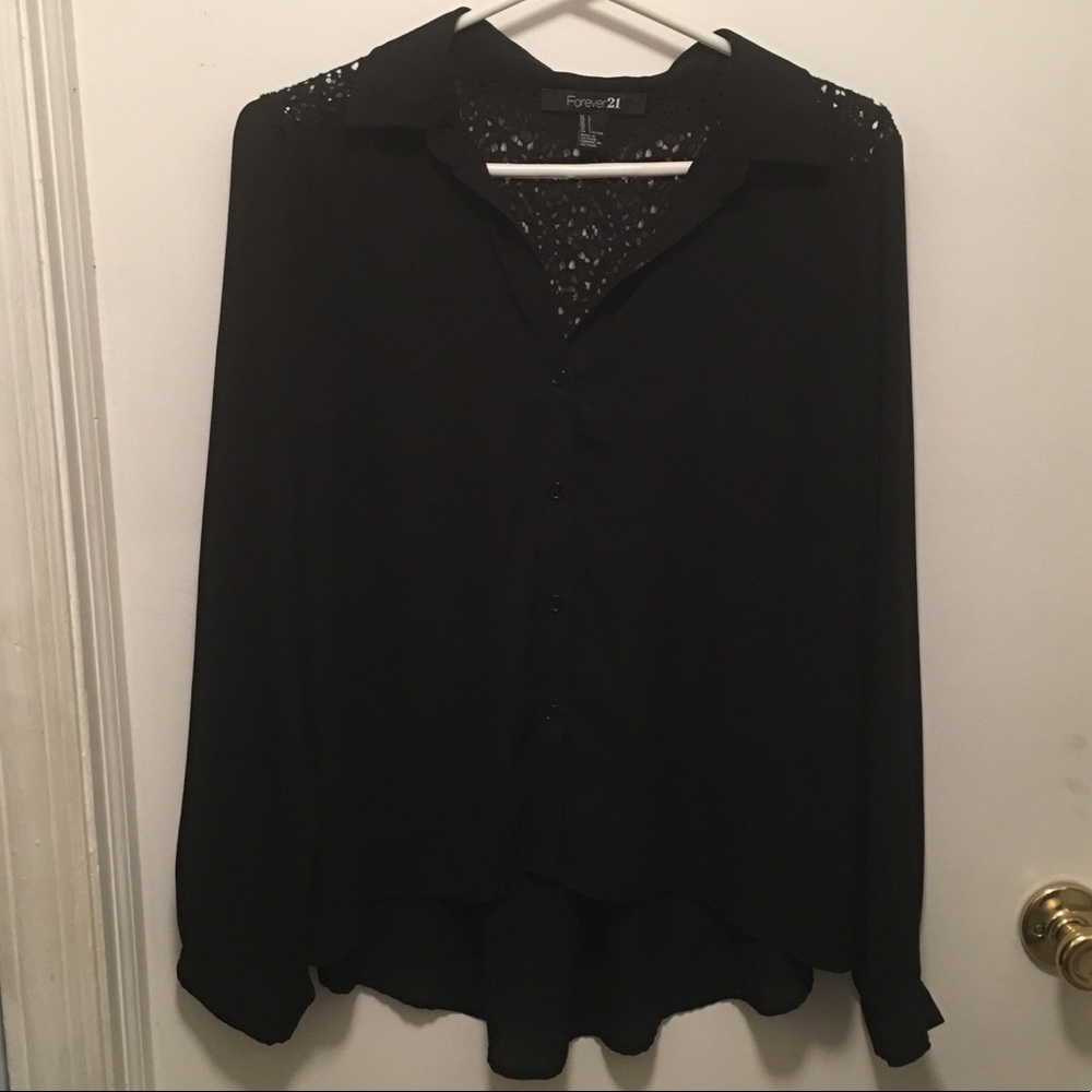Black long sleeve blouse with lace detail on back.